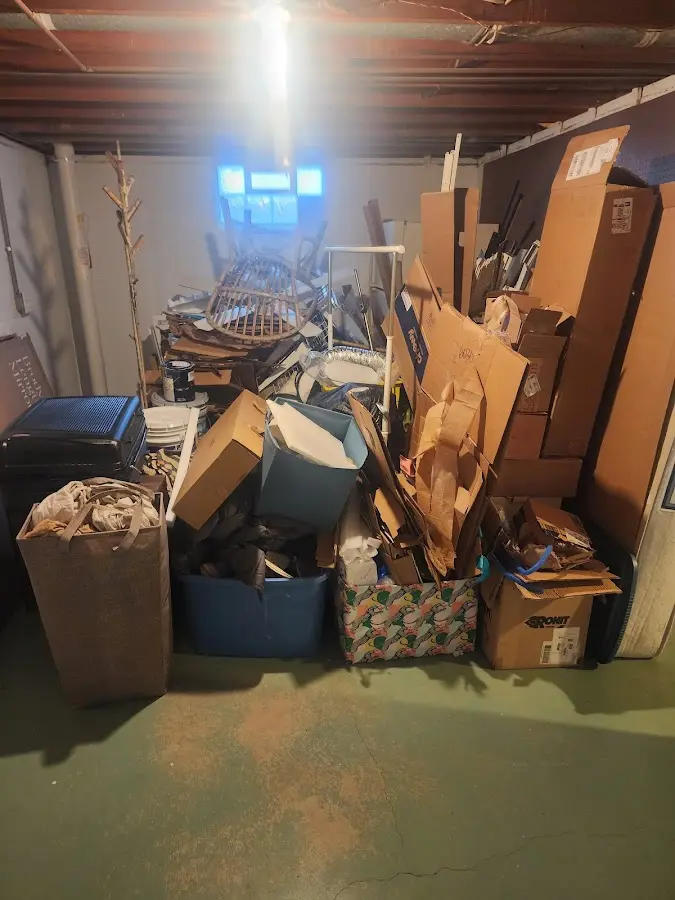 Roll-off dumpster container at job site for Cleanout Dumpster Rental in Millcreek